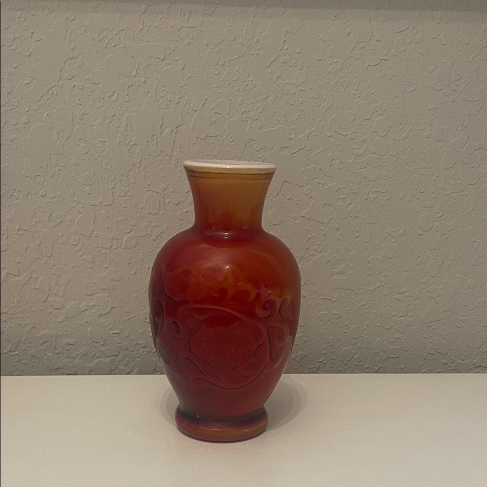 Elegant Red Vase with Floral Design
